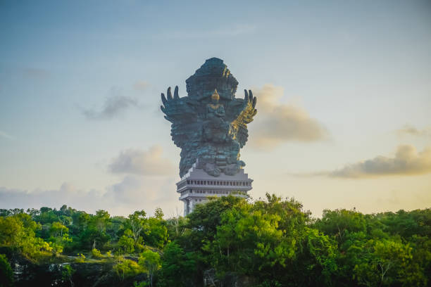 huge statue of garuda at garuda wisnu kencana cultural park in bali - garuda imagens e fotografias de stock