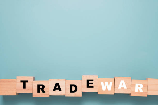 istock Trade war wording print screen on wooden block cube with blue background. 1294272361