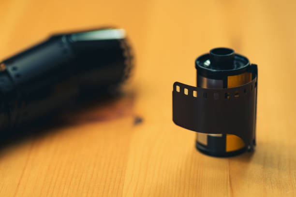 istock 35mm negative camera film on a wooden background 1294273853