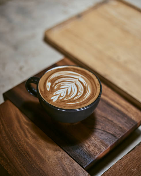 istock Hot latte art coffee on wooden table 1294274598