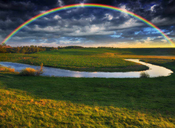 istock Landscape with a Rainbow on the River in Spring 1294274956