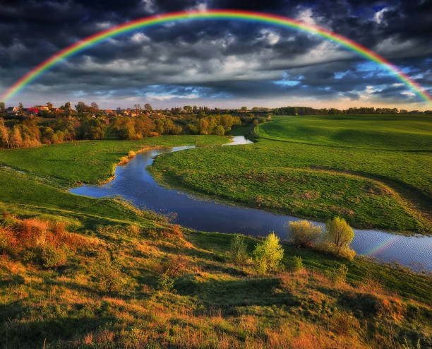 istock Landscape with a Rainbow on the River in Spring 1294274981