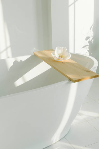 istock Minimalistic white bathroom in white room 1294275597