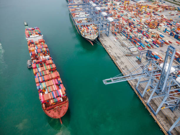 istock Container ship waiting for load container box in terminal blue ocean logistics transportation concept 1294277689