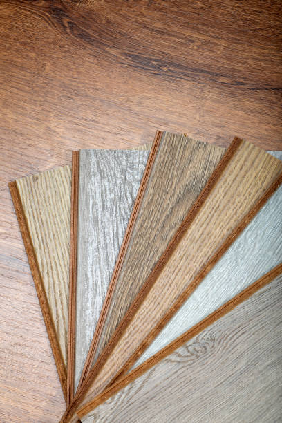 istock Laminate background. Samples of laminate or parquet with a pattern and wood texture for flooring and interior design. Production of wooden floors 1294278442