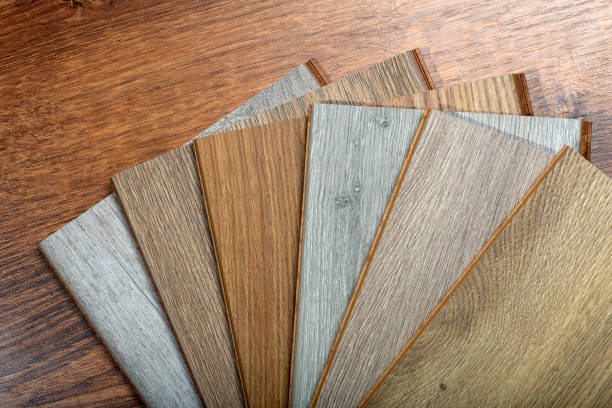 istock Laminate background. Samples of laminate or parquet with a pattern and wood texture for flooring and interior design. Production of wooden floors 1294278443