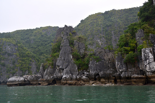 Limestone hills on the beautiful Lan Ha bay in Northern Vietnam.