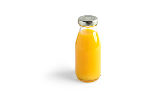 istock Orange juice in bottle on a white background 1294280628