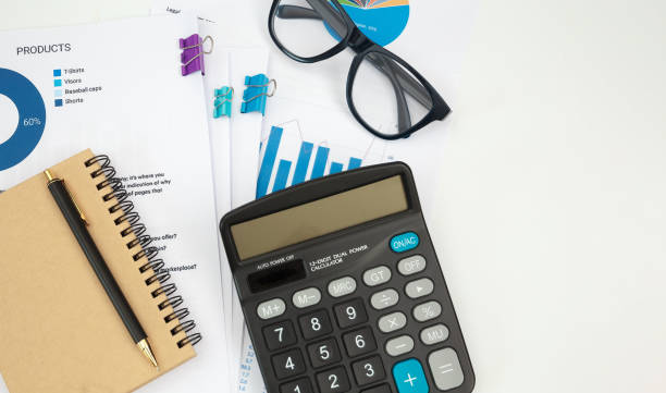 istock Business accounter working with documents and calculator on white office desk 1294283236