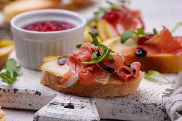 istock Toasts with pear and prosciutto 1294284810