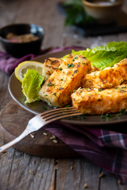istock Cooked fish fillet with lemon and vegetables 1294285669