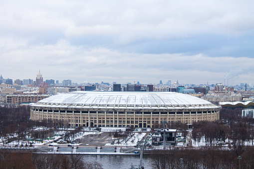 Panoramic top view of Luzhniki Stadium on a cloudy winter frosty day and space to copy in Moscow