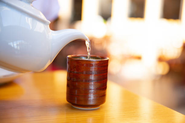 istock pouring hot water into the cup to make coffee 1294291186
