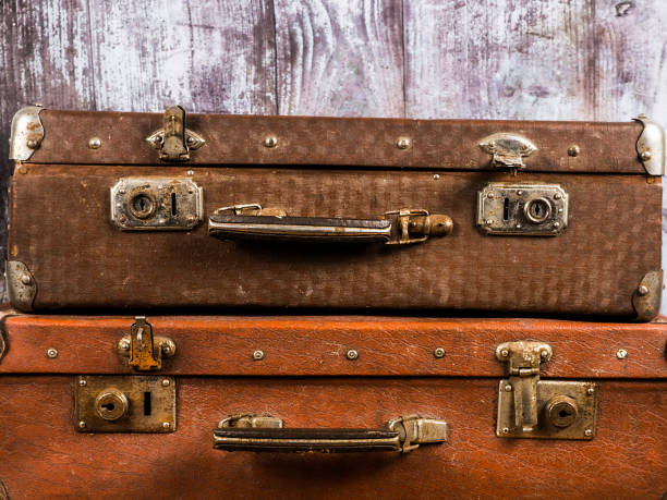 istock Two vintage suitcases. Retro style. Background and texture. 1294296196