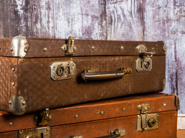 istock Two vintage suitcases. Retro style. Background and texture. 1294296197