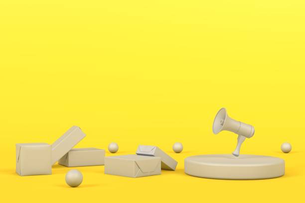 istock Gray gift boxes and gray megaphone on yellow background 1294297877