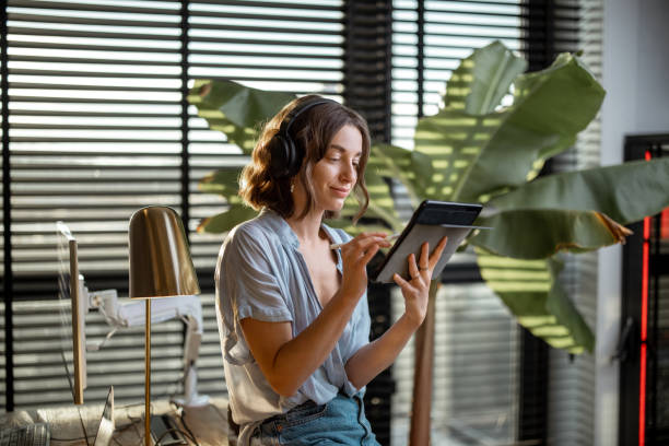istock Woman working on a digital tablet at home office 1294300807