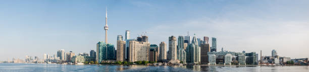 Toronto City Skyline Panorama of downtown Toronto taken early in the morning from the Toronto Island Ferry toronto photos stock pictures, royalty-free photos & images