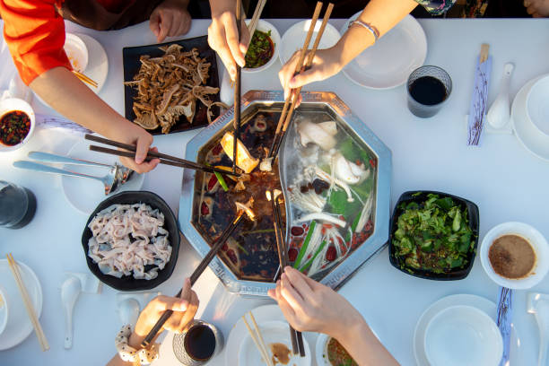 istock Friends having a hot pot meal together 1294301154