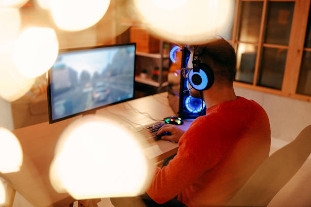istock Mature  man playing online games on laptop computer at home. 1294302249