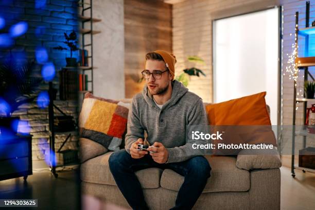 Online Gaming Concept Guy Playing Football Video Game With Joystick Stock Photo - Download Image Now