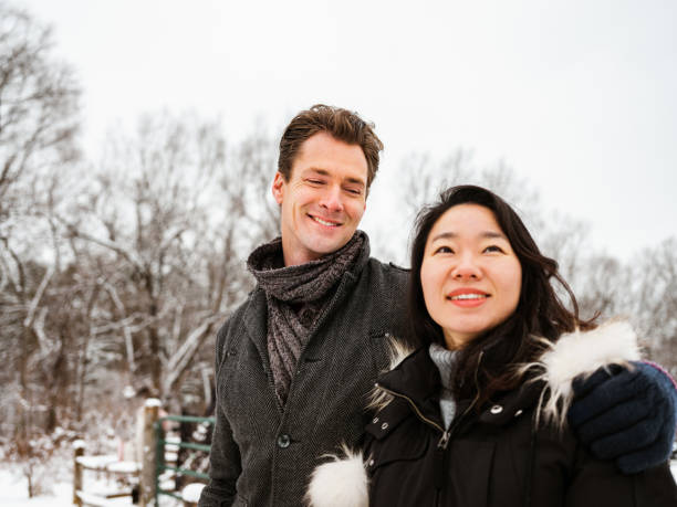 istock Mixed race couple snowshoeing in winter 1294304686