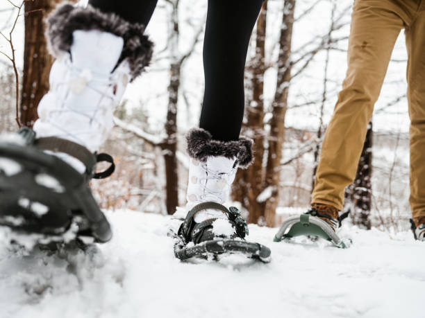 istock Mixed race couple snowshoeing in winter 1294304799
