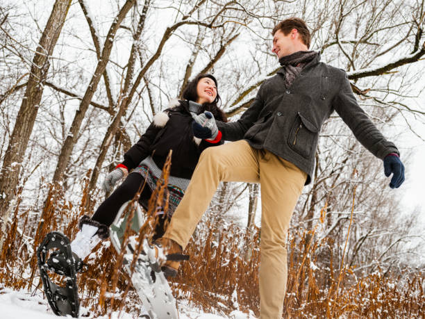 istock Mixed race couple snowshoeing in winter 1294304814