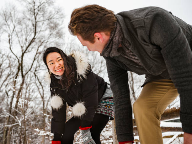 istock Mixed race couple snowshoeing in winter 1294304833