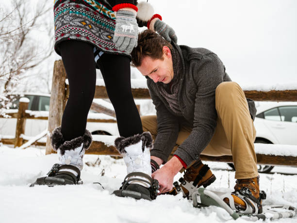 istock Mixed race couple snowshoeing in winter 1294304892