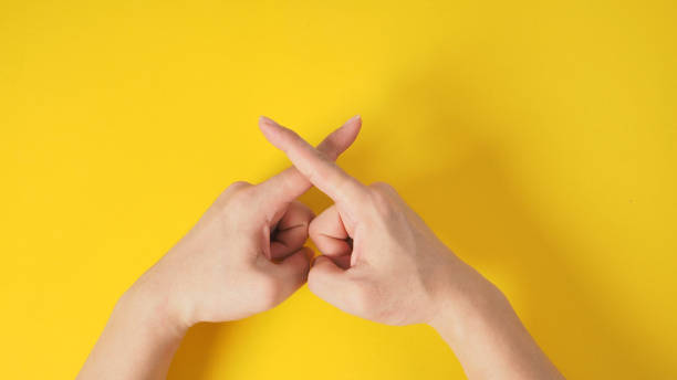 istock Forbidden or rejection hand sign on yellow background. 1294308784