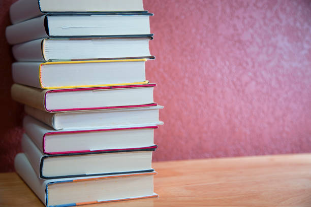 istock Textbooks on wooden desk. 1294311163