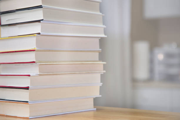 istock Textbooks on wooden desk. 1294311290
