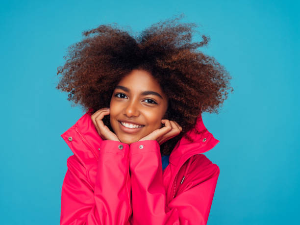 istock Young woman wearing raincoat 1294311302