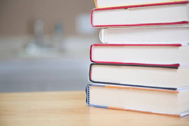 istock Textbooks on wooden desk. 1294311332