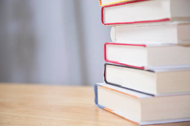 istock Textbooks on wooden desk. 1294311338