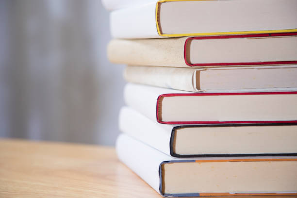 istock Textbooks on wooden desk. 1294311345