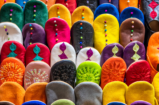 Colorful traditional shoes (babouches) for sale at street market in Marrakesh, Morocco