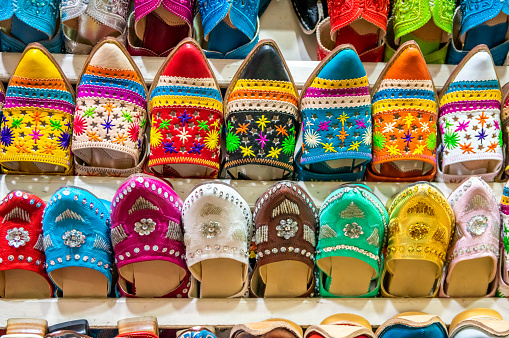 Colorful traditional shoes (babouches) for sale at street market in Marrakesh, Morocco