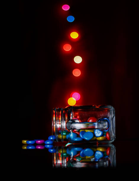 istock Colorful light bokeh and coffee mug on dark background 1294316844
