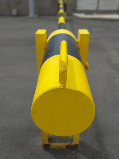istock Yellow and black Roadblock Road Barrier perspective view. Metal security barrier. Fixed gate barrier. Beaconing and signaling concept. 1294317645