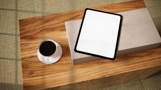 istock Tablet mockup with coffee life style photo. Window Shadows. Useful for mockups 1294317735