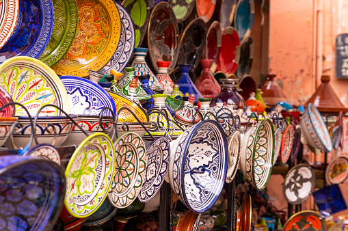 Moroccan pottery in Marrakesch. Colorful ceramics and pottery displayed outside a shop. Beautiful oriental design with plenty of colors