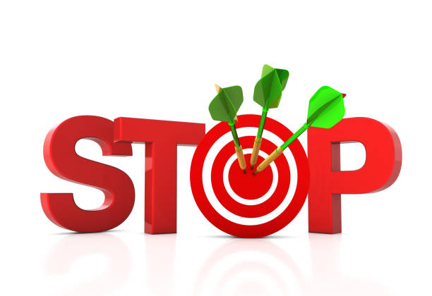 istock 3D Word STOP with Target and Dart 1294317957