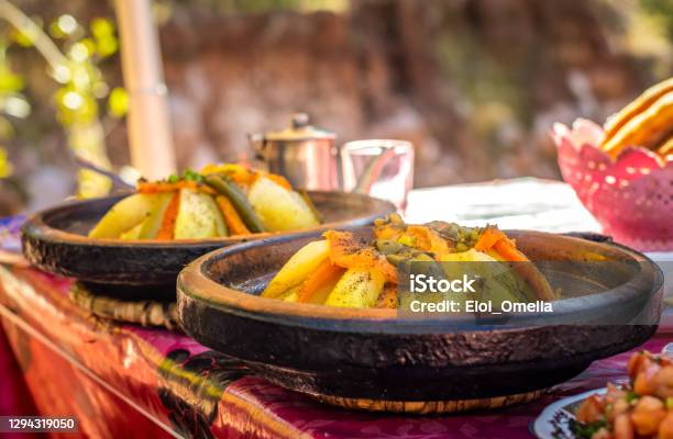 Two Traditional Moroccan Chicken Tajine With Chickpeas And Vegetables In A Hot Plate Stock Photo - Download Image Now