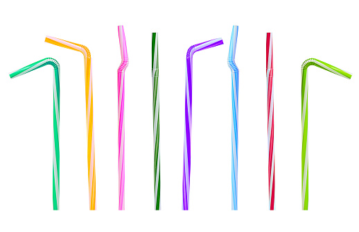 multicolored tubes for cocktails and juices on a white background