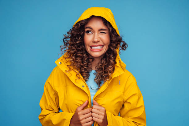 istock Smiling beautiful woman in raincoat 1294319866