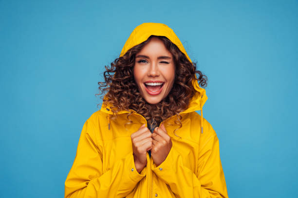 istock Beautiful woman in yellow raincoat 1294319909