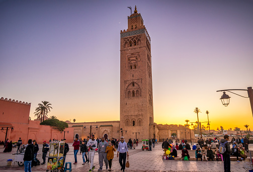 Marrakech, Morocco - January 20, 2018: peoploe in front of Koutoubia Mosque in Marrakesh at sunset