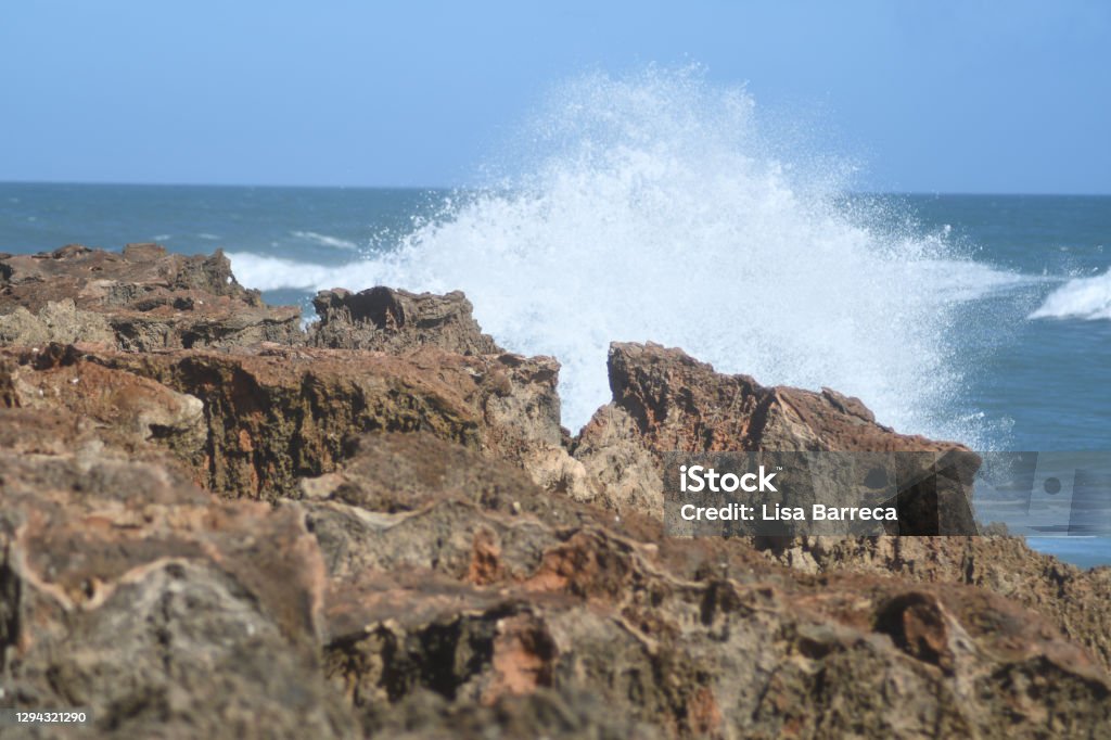 Crashing In Waves crashing into the rocks Beach Stock Photo